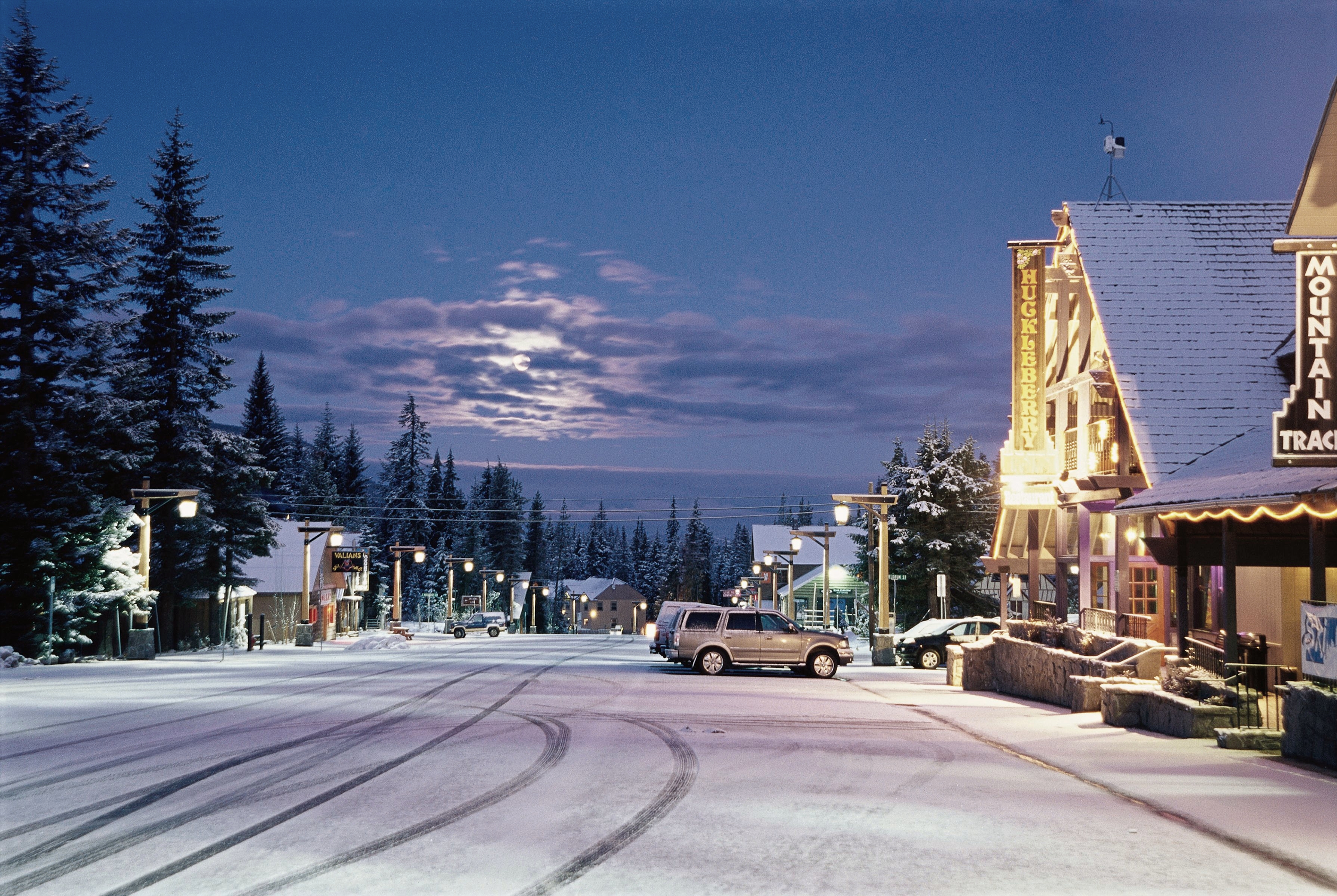 Aerial view of Government Camp village at night covered in snow